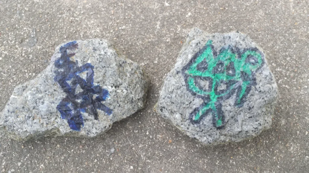 two handpainted meditation stones